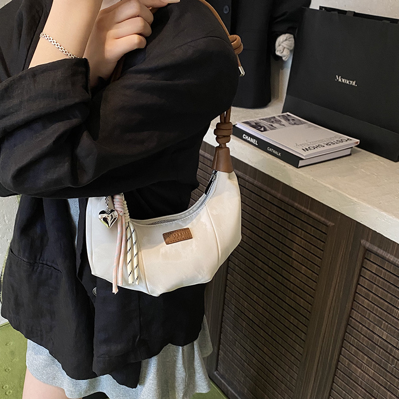 Bolsa de brazo simple coreana para mujeres 2025, nueva bolsa de hombro de empalme extranjero para trabajar, bolsa de mochila ocio
