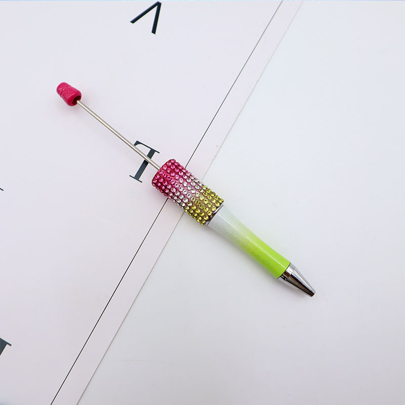 Bolígrafo giratorio de grano lindo de color degradado de tendencia de alto valor Bolígrafo de gomas galvanizado con cuentas de diamantes de bricolaje creativo