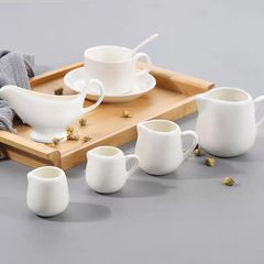 ホテルのソースの杯の陶磁器のステーキの汁の闘いのミルクの杯のコーヒーのミルクの缶の砂糖の杯の缶の洋食のカウンターの小さい部品のlogo