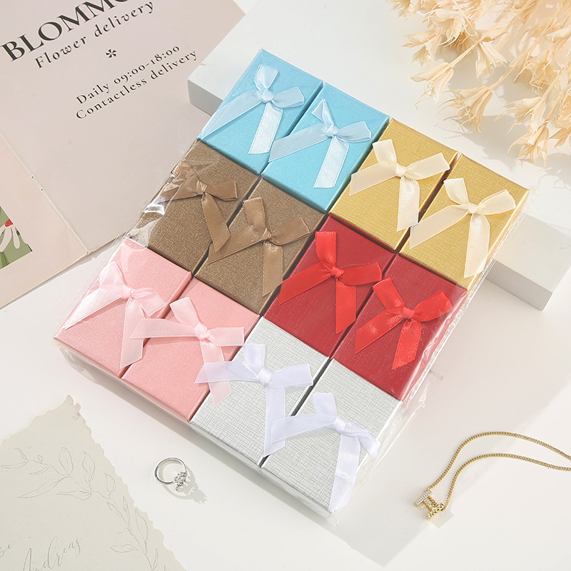 Moderno sistema minimalista de arco de color sólido caja pequeña caja de regalo de vacaciones caja de joyería hermosa caja de color mezcla al por mayor