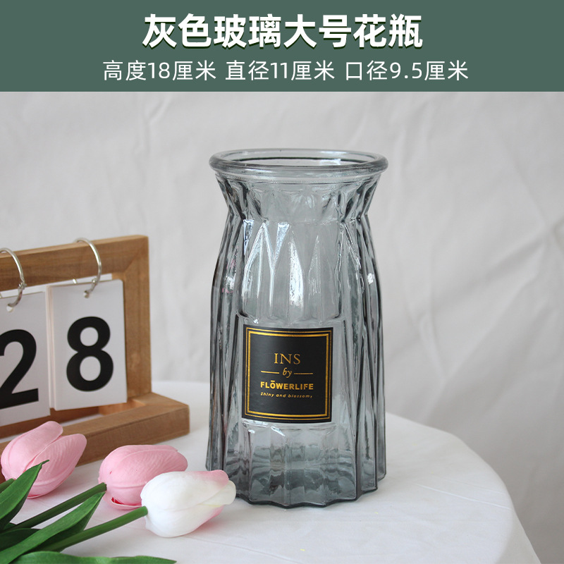 Gran botella de vidrio gris