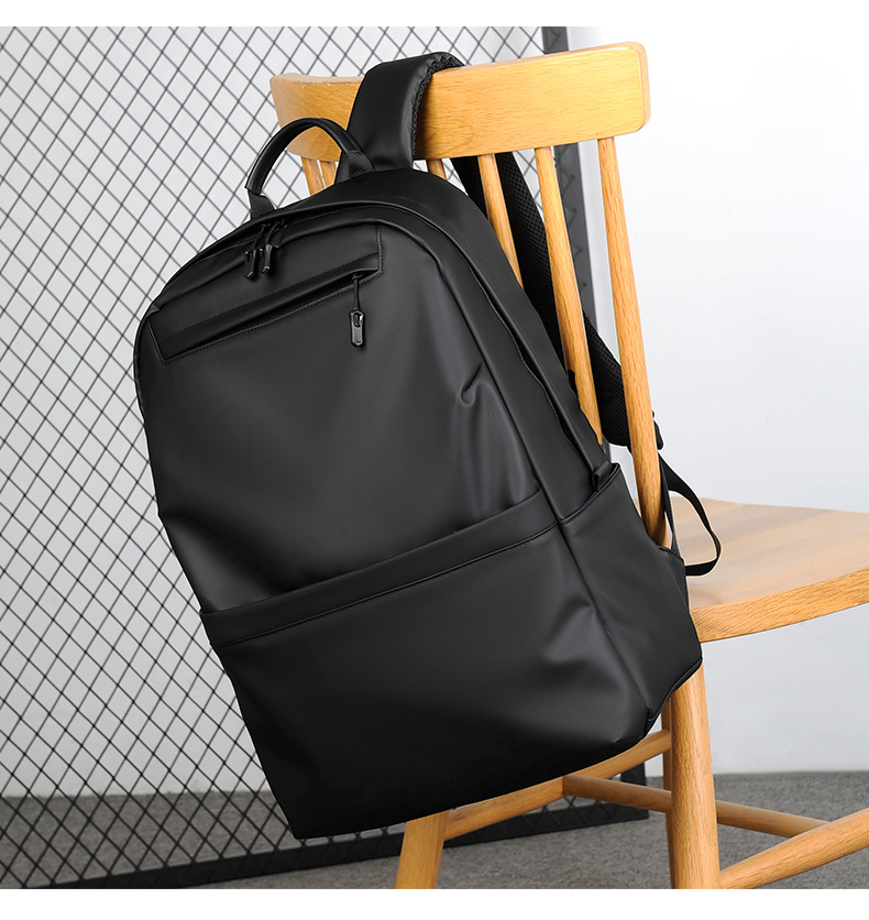 A new minimalist backpack for men, a Korean-style casual and fashionable backpack for laptops, with a logo printed on it undefined