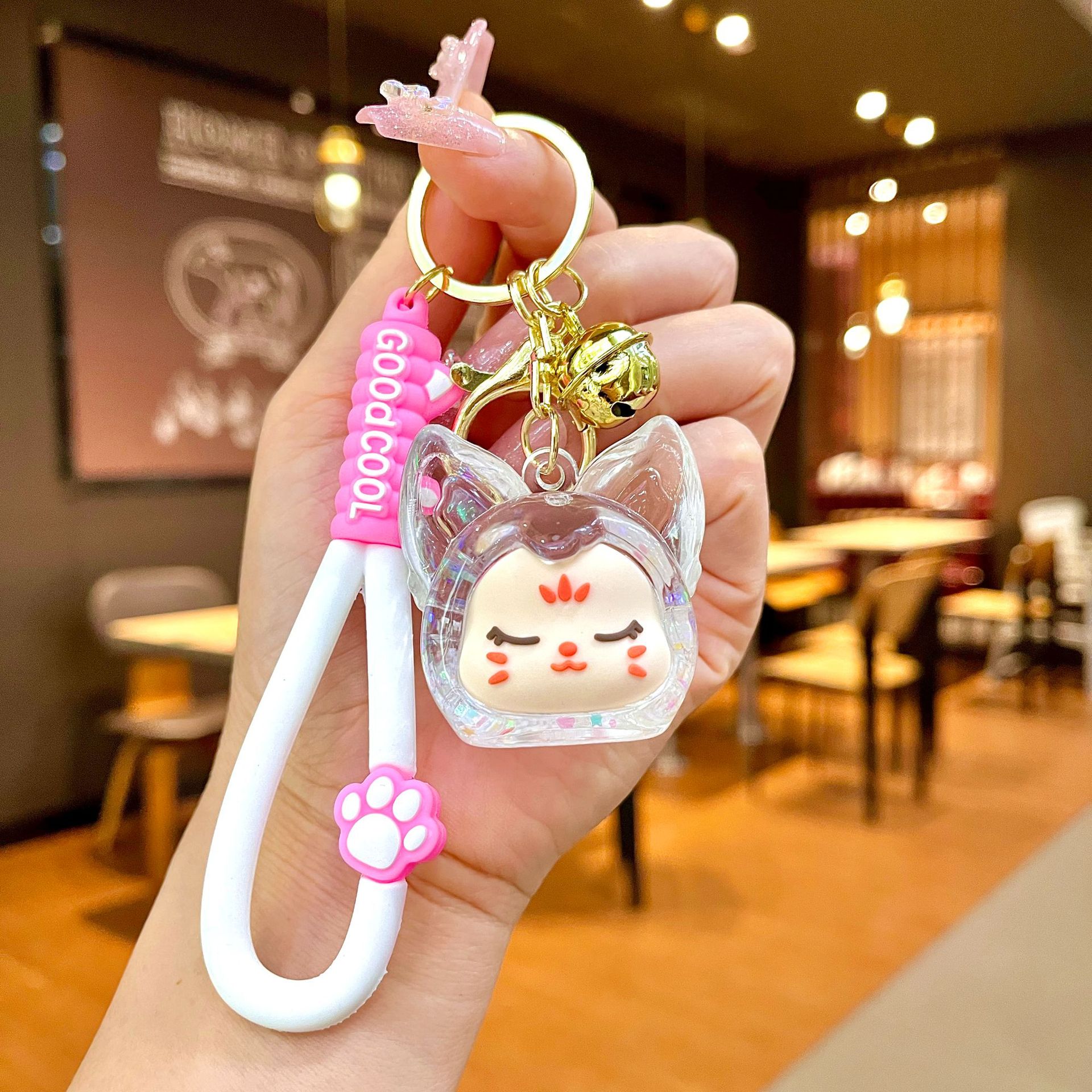 Aceite de gato garra arenas movedizas llavero lindo dibujos animados cadena colgante captura muñeca máquina agarrar pequeño regalo al por mayor