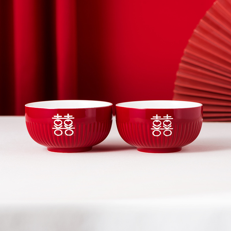 웃는 얼굴이 새겨진 줄무늬 찻그릇 한 쌍