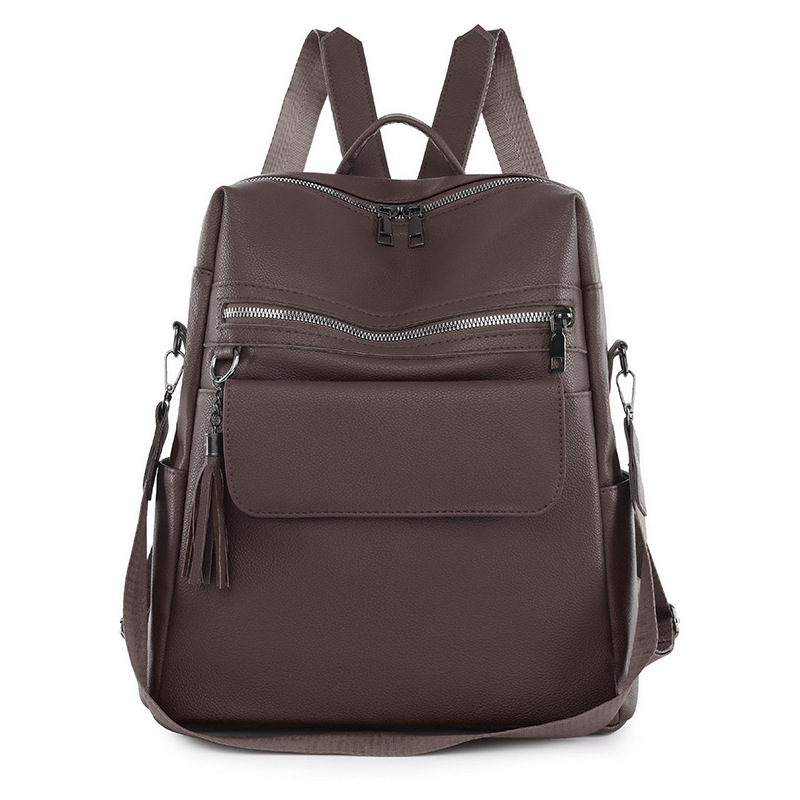 2024 nueva mochila de PU de moda casual para mujer, borla de moda, mochila de viaje de color sólido de gran capacidad al por mayor