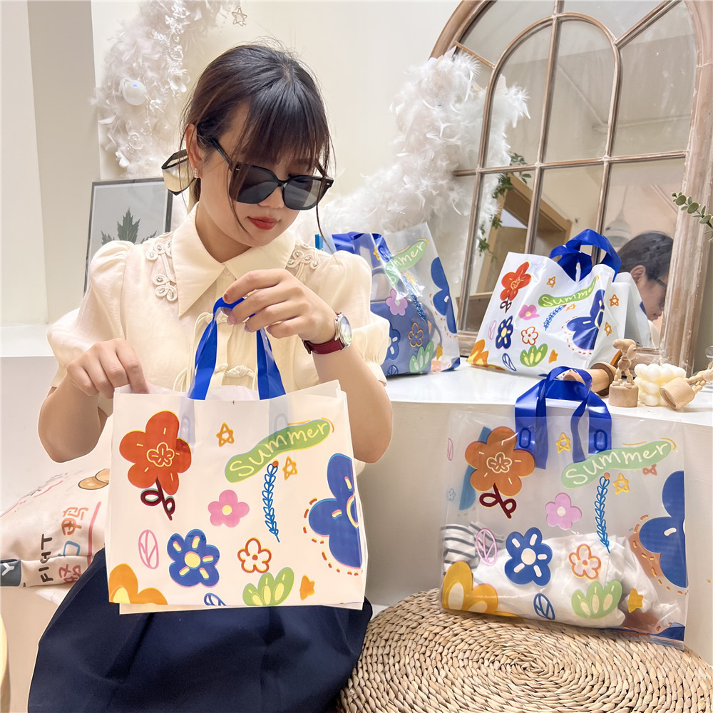 Pequeña flor rota transparente engrosada elegante tienda de ropa de mujer bolso de embalaje de plástico regalo plástico fresco