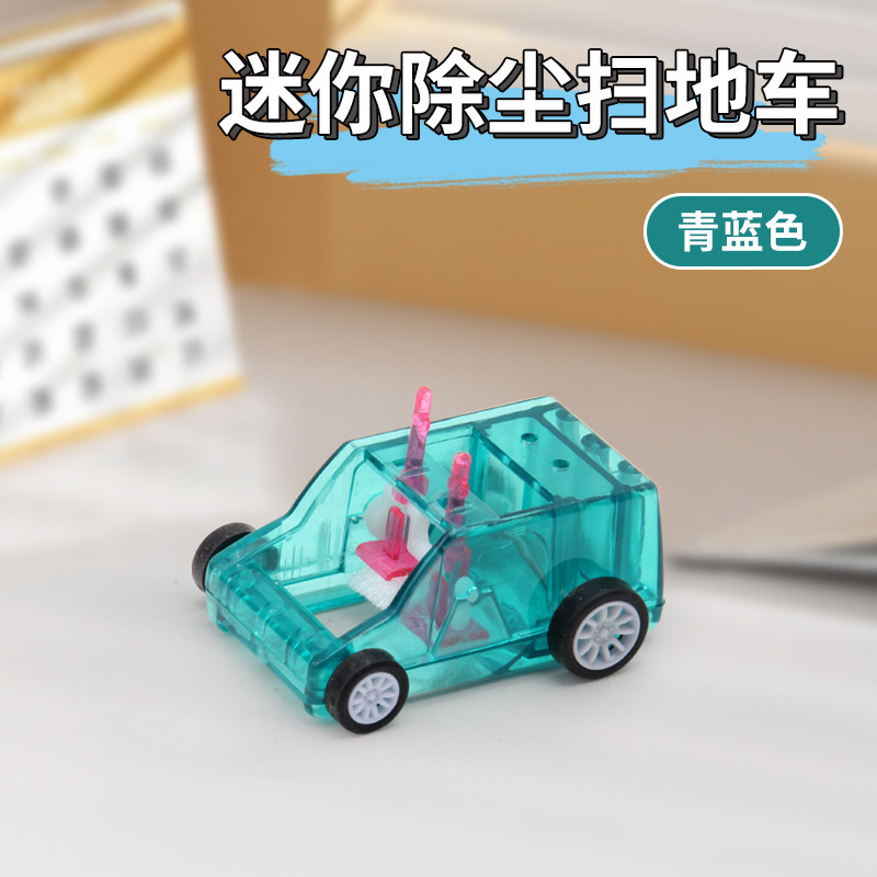 学生の子供のミニデスクトップの清潔な車の鉛筆のくずの消しゴムの掃除器のごみの車の手は滑車の子を押します。|undefined