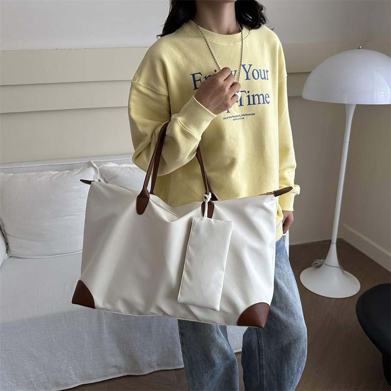 Bolsa de viaje para mujeres 2024 nueva sensación de alto nivel bolsas de bolsas de viajes portátiles bolsas de bolsas de moda de hombro de gran capacidad para mamá