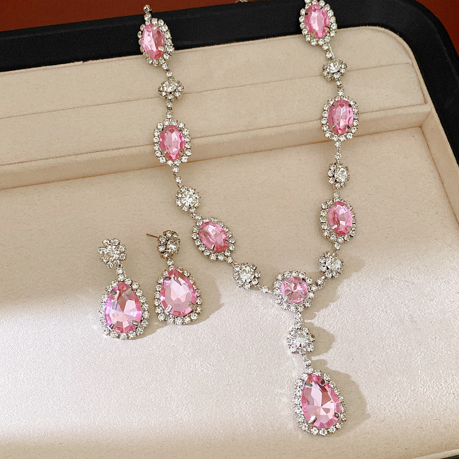 Collar de pendientes de gota de agua elíptica rosa ligero de lujo nicho cadena de clavícula temperamento delicado conjunto de joyas al por mayor