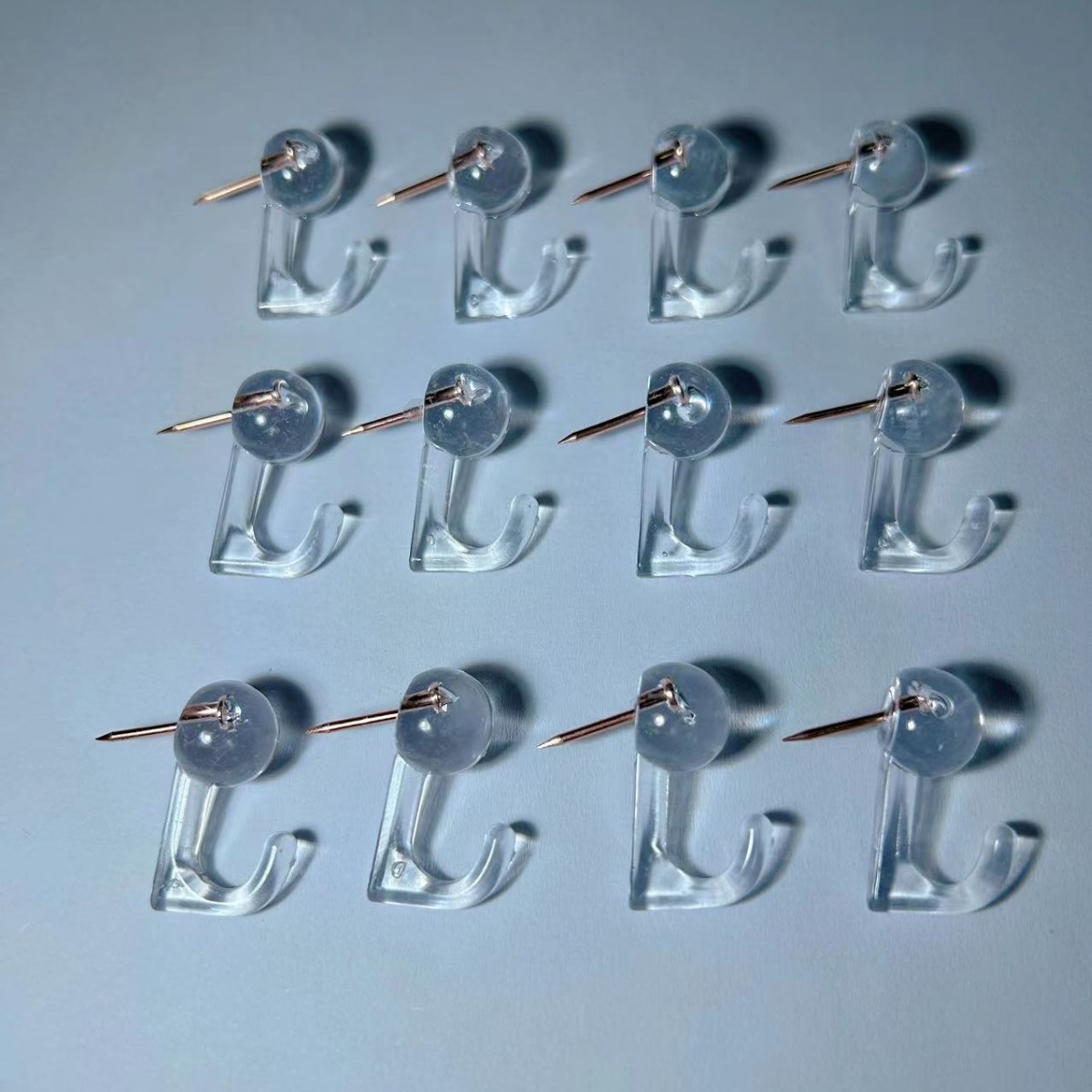 Suministro directo de fábrica de ganchos de plástico de oro rosa transparente, clavijas, clavijas, tableros de mensajes, clavijas de pared de fotos