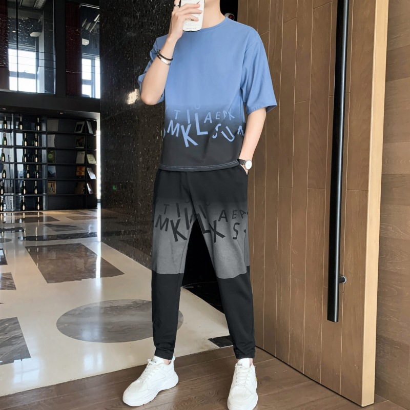 Dispositivo de deporte casual de hombre marca de moda camiseta de cuello redondo manga corta versión suelta de dos piezas conjunto de pies nueve puntos