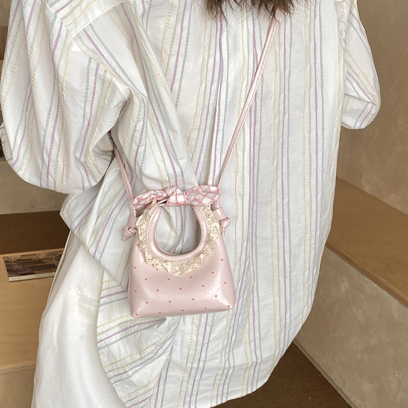 Pequeño arco fresco bolso de hombro de niñas bolso de encaje extranjero amor ondulado mini bolso para niños