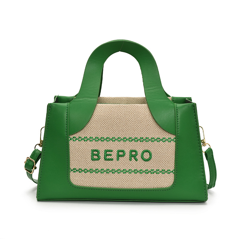 2026 estilo de moda letras impresión de mano mano de hombro oblíquo empalme de color nuevo bolso cuadrado simple europeo y americano