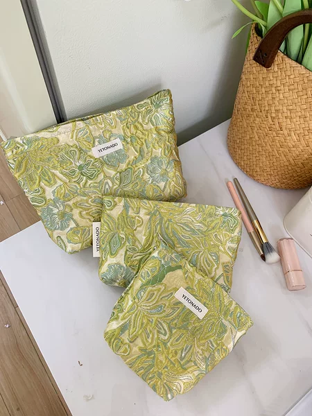 Cross-border ins-style three-dimensional embossed floral makeup bag with a gentle texture, portable storage bag, and handbag for outings
