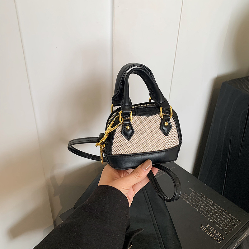 Mochila de moda de leopardo para niñas, mini bolso de concha portátil para bebés, 2025 nuevo bolso de comercio exterior para niños