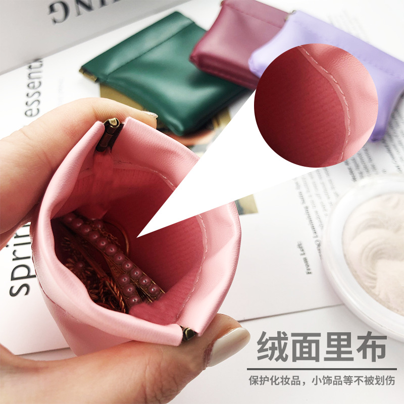Venta al por mayor de cuero servilleta sanitaria lápiz labial bolsa de almacenamiento de metralla bolsa de almacenamiento mini ins estilo pu cuero pequeño monedero
