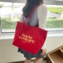 大容量字母单肩双面包包