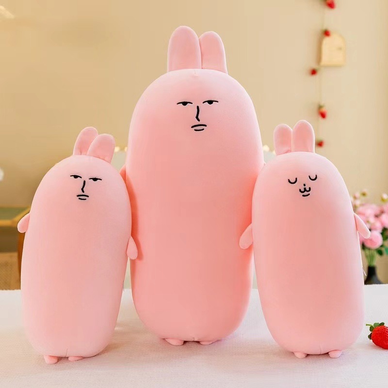 爆発的なピンクのウサギの長いバーは枕のベッドの上で足のぬいぐるみの女の子のプレゼントの子供のプレゼントの卸売りを挟みます。|undefined