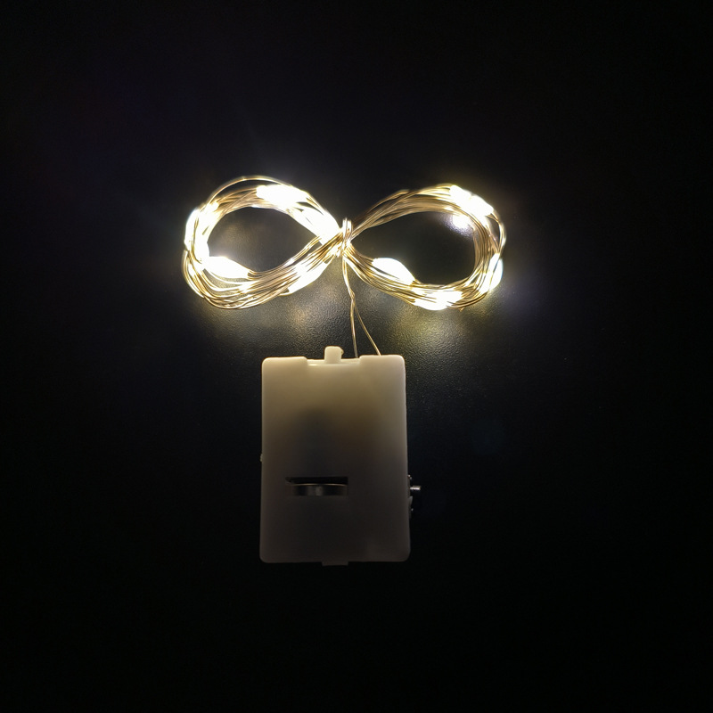 65000810 led铜线小白盒灯串-1米10灯 暖白