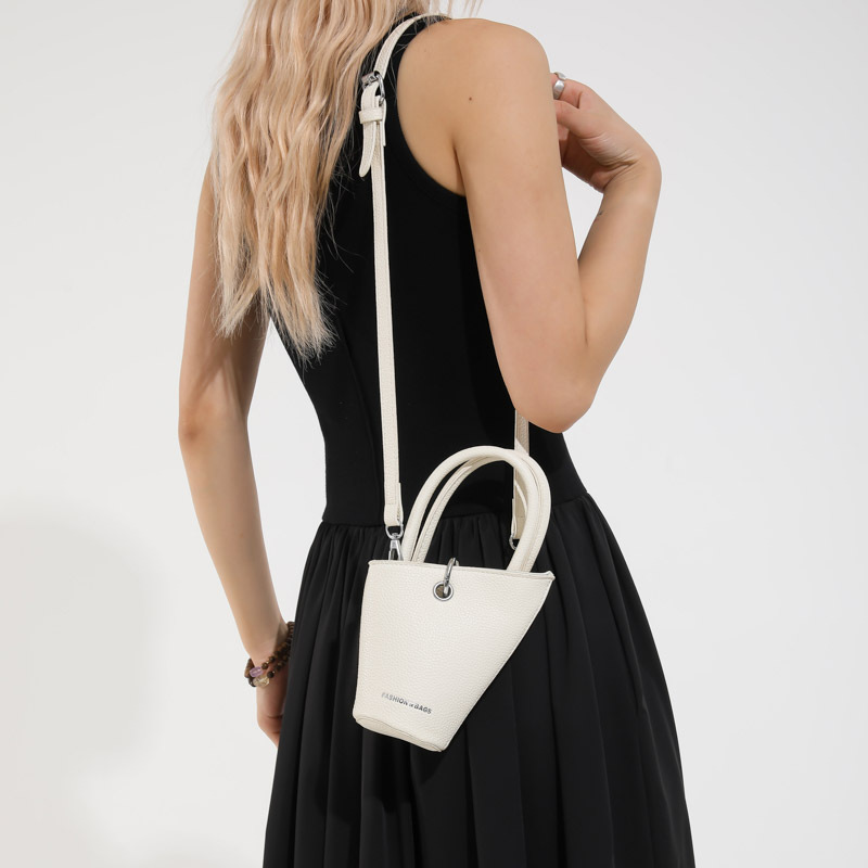 Bolso de cubo de diseño de nicho 2025 verano nuevo bolso de hombro con patrón de lichi mini bolso de mensajero de letras mujer