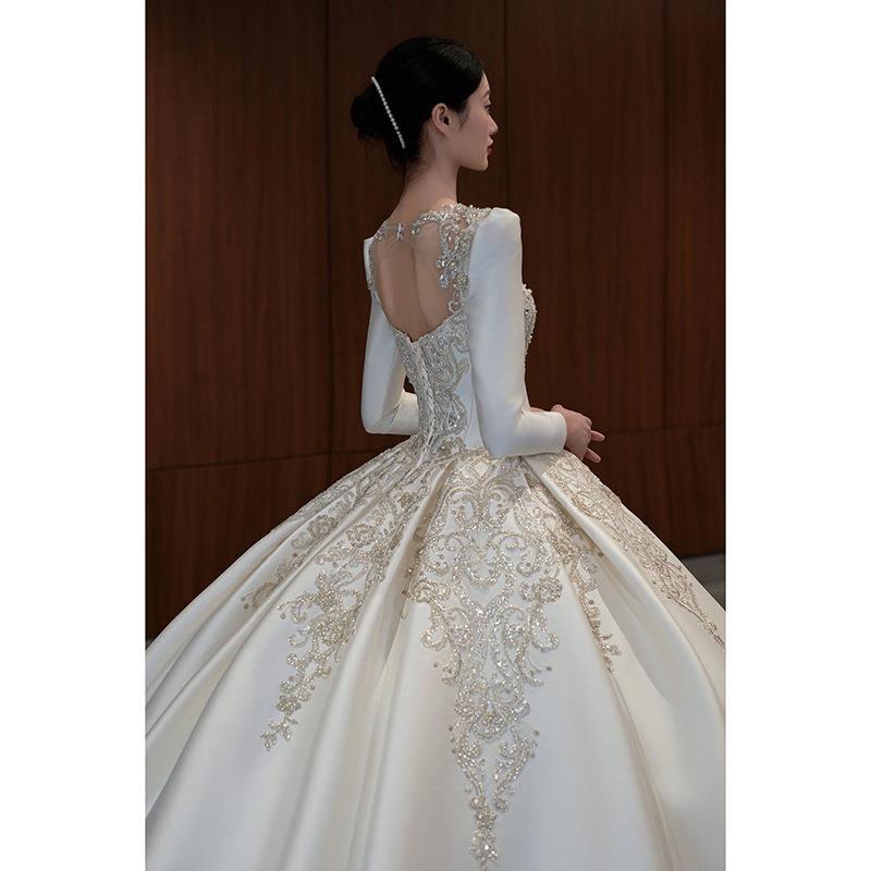 Vestido de novia de satén texturizado de alta gama, estilo invierno 2026, de manga larga, estilo princesa, con cola, de lujo, estilo francés.