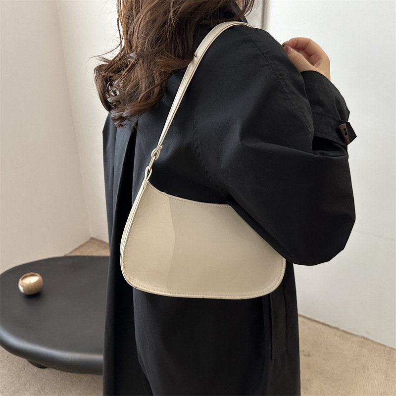 Bolso de sentido de alta gama para mujer 2024 nuevo bolso de palo francés bolso retro portátil para axilas bolso de charol de un solo hombro para niña de estilo occidental