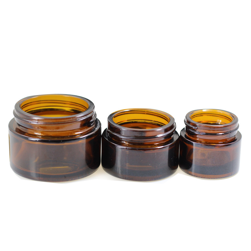 Fabricante al por mayor de botellas de crema para ojos de 50g, botella cosmética negra para crema facial, botella dispensadora de vidrio vacía, botella de crema marrón de 10g