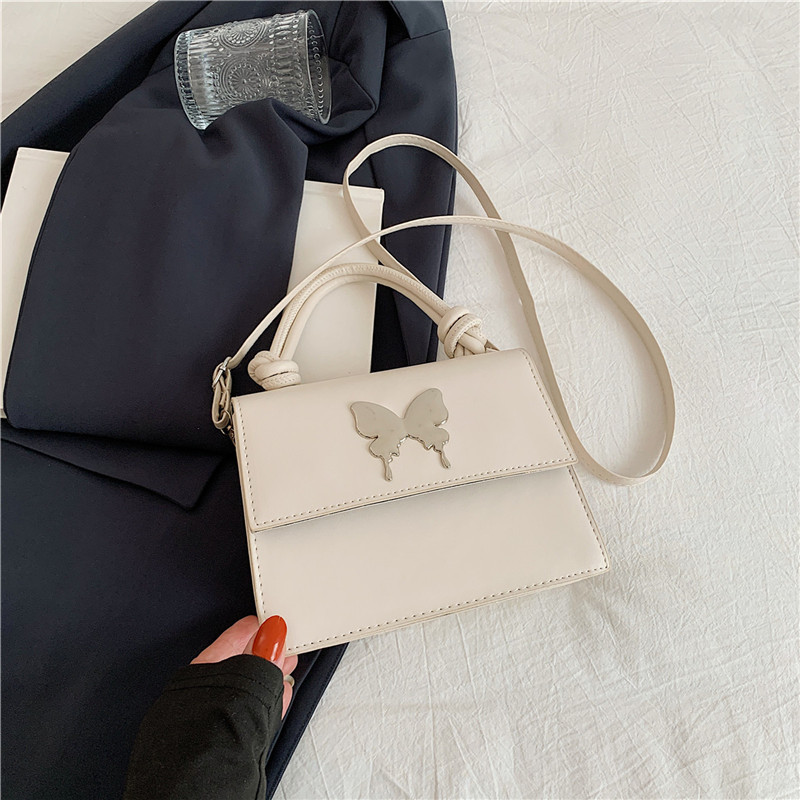 Diseño de nicho de lujo ligero bolso de mano de este año popular arco decoración de viaje diario mochila de hombro para mujeres