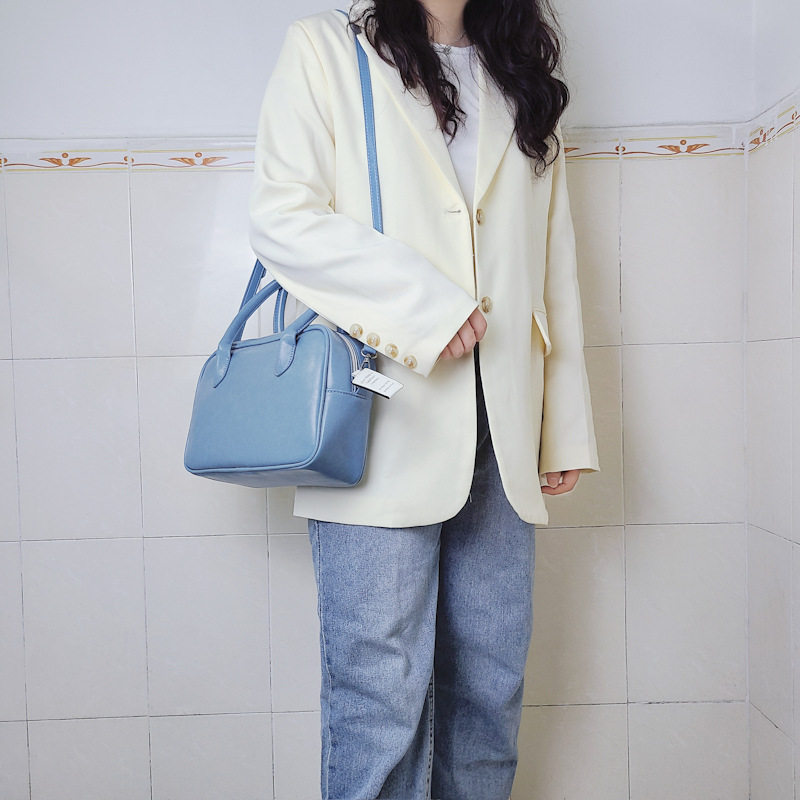 Design di nicchia coreano con la stessa borsa color crema e una borsa elegante, borsa quadrata con croce diagonale a spalla singola_voghion.com