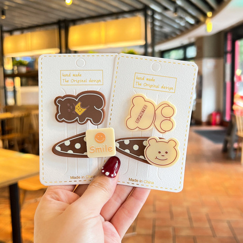 Trendy milk coffee-colored hair accessories for little girls: Adorable cartoon bear-shaped clips, perfect for baby bangs and stray strands—also great as kids' hairpins!