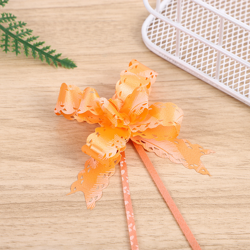 Comercio exterior Venta caliente 18 impreso encaje arco mano-Tirado flor Navidad vacaciones regalo embalaje tirar flor multicolor multi-patrón