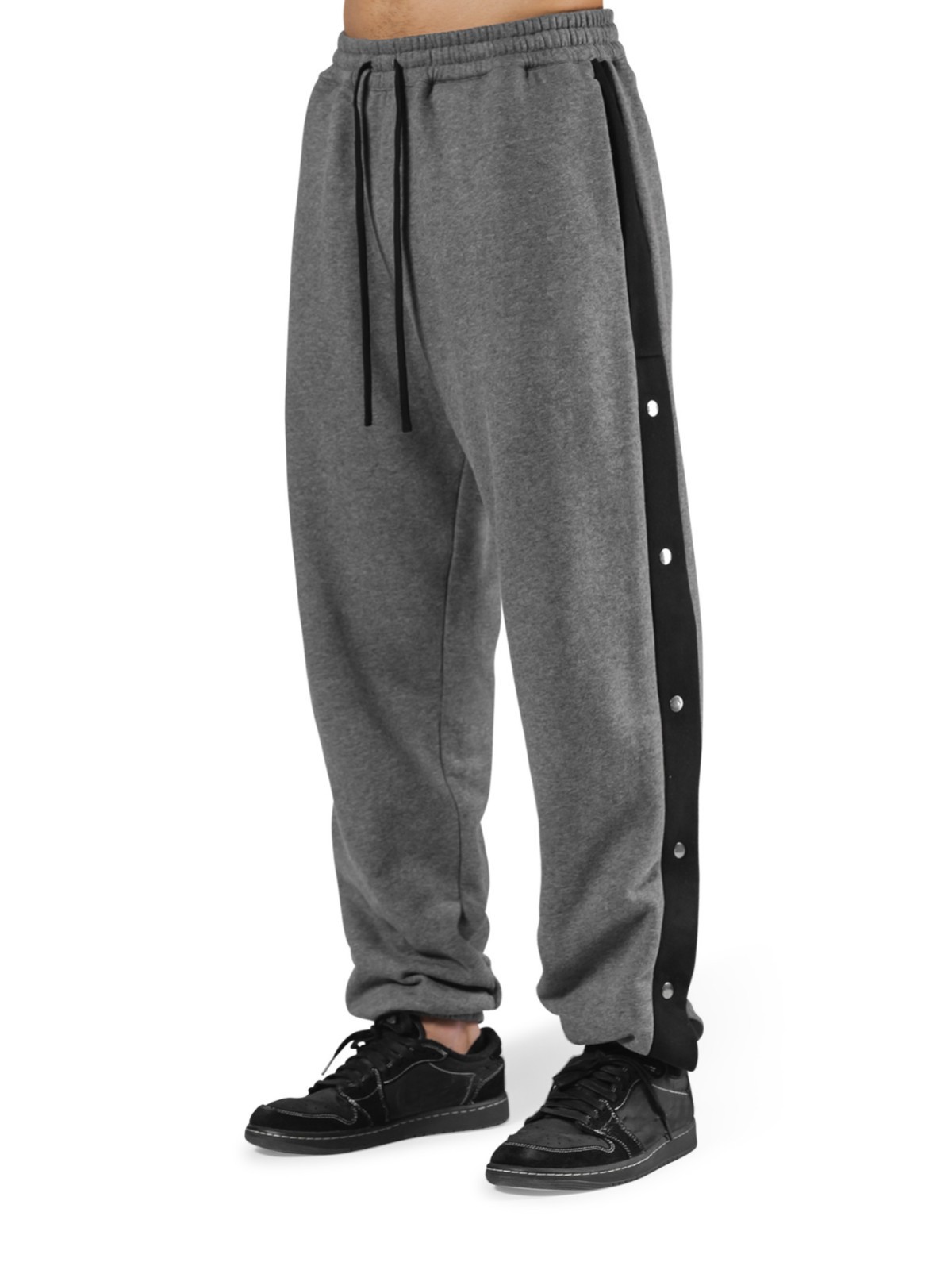 Los deportes de otoño e invierno de los músculos locos están completamente abiertos con hebillas y pantalones de terciopelo. los hombres están relajados y relajados. los pies están atados en otoño e invierno y los pantalones deportivos de terciopelo.