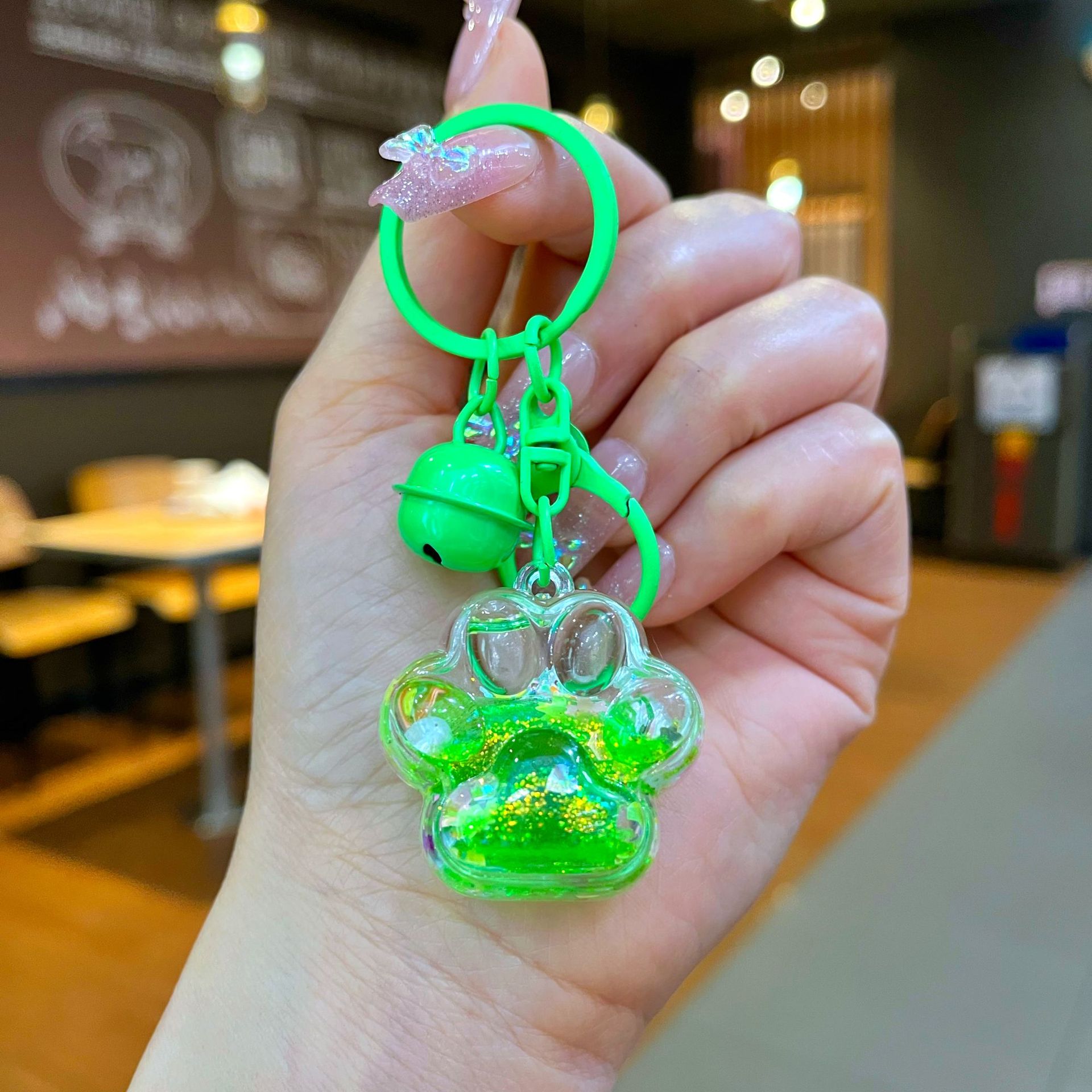 Aceite de gato garra arenas movedizas llavero lindo dibujos animados cadena colgante captura muñeca máquina agarrar pequeño regalo al por mayor