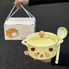 かわいい陶磁器の泡の碗は蓋の学生の寮を持っています。