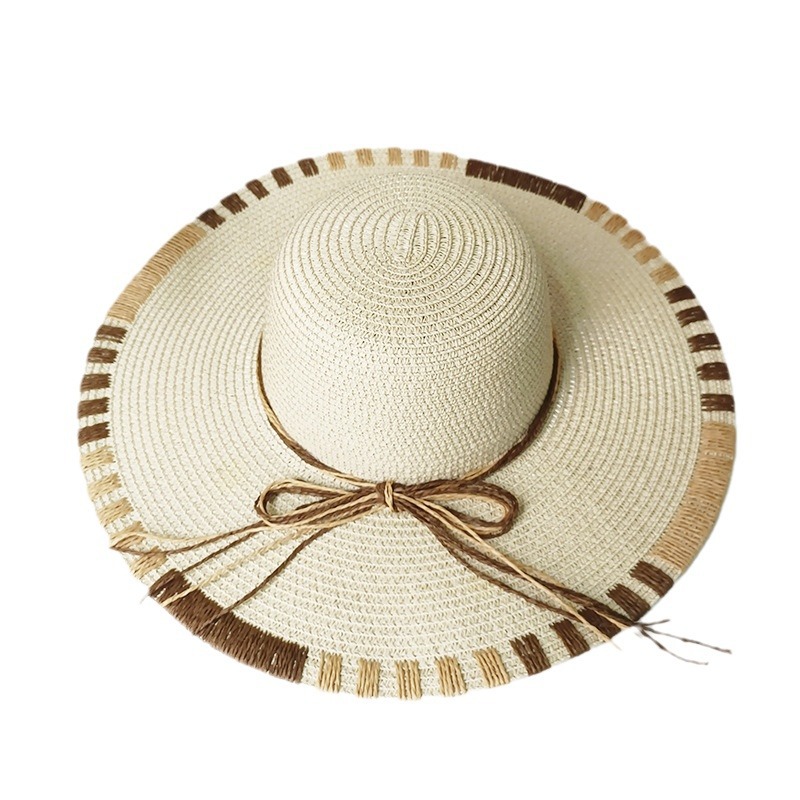 Gran sombrero sombrero de paja primavera y verano vacaciones de mar sombrero de sol damas moda para cubrir la cara arco sombrero solar al por mayor