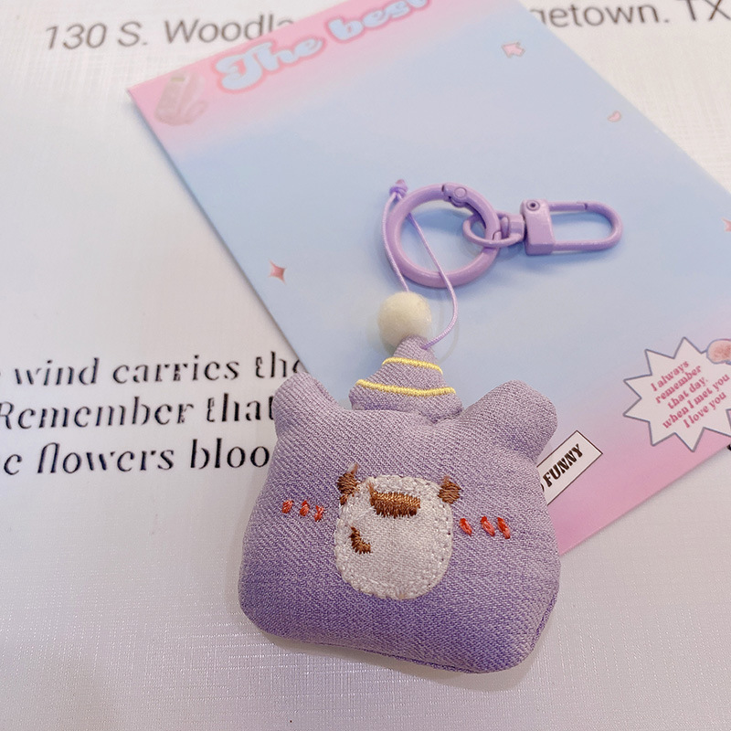HD843A025 tela de otoño púrpura relleno de algodón muñeca llavero colgante bolso colgante de teléfono móvil