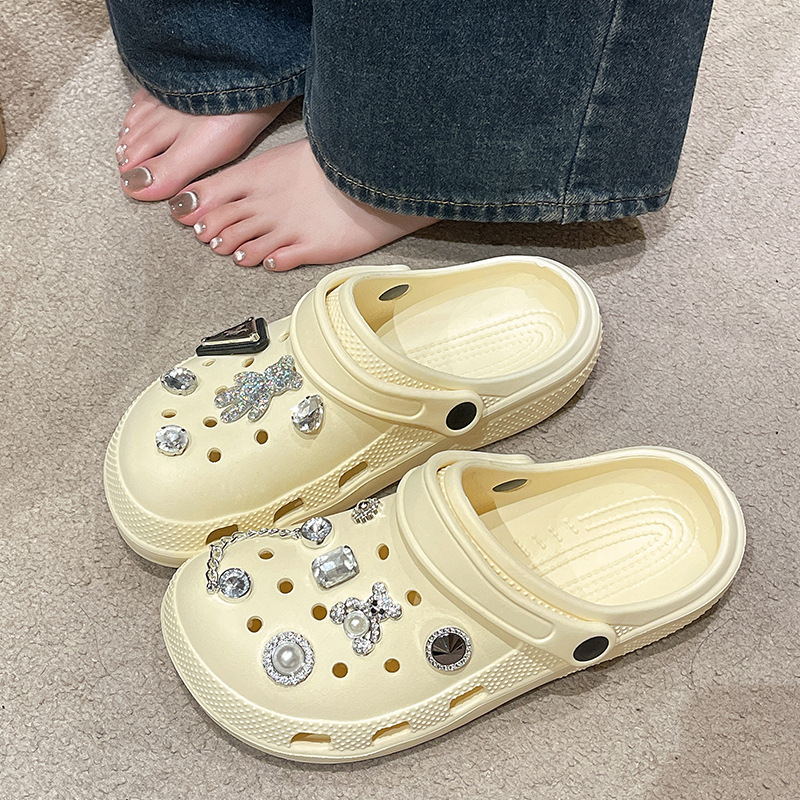 Beige Crocs-style slippers flat