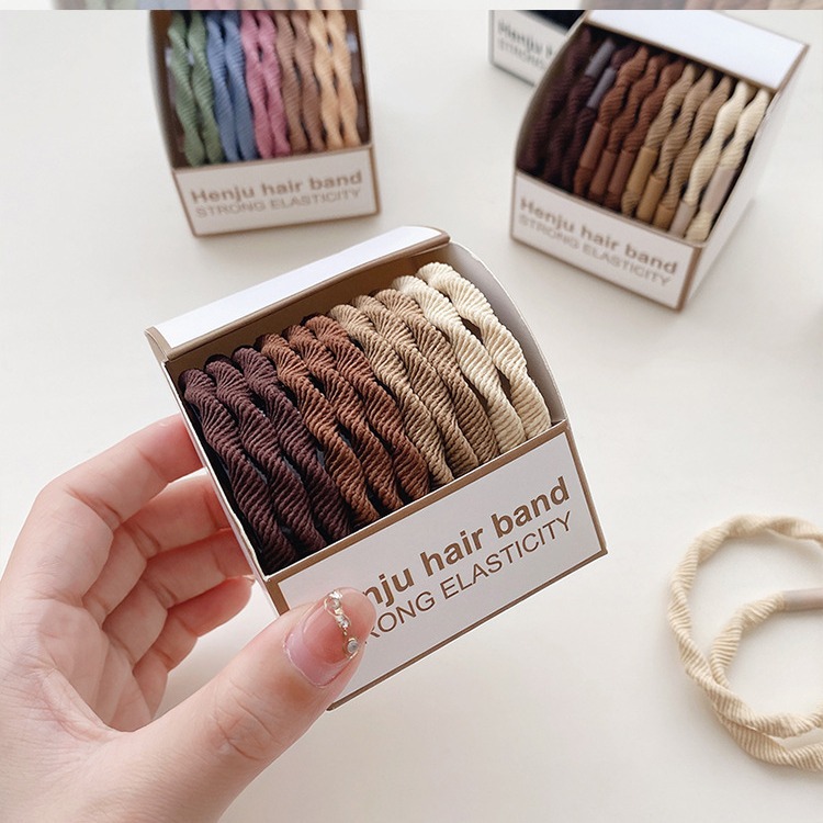 Banda de goma 2023 nueva cubierta de cuero pequeña corbata de pelo de verano para mujer cuerda de pelo duradera de alta elasticidad cuerda de pelo anillo de pelo tocado