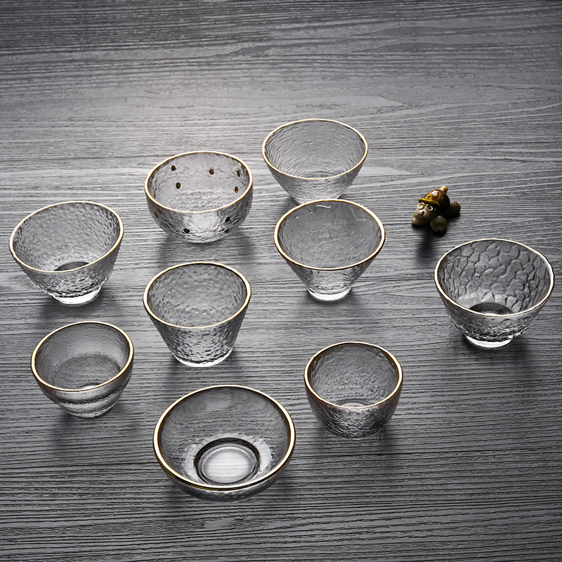 Patrón de martillo Xingran vidrio resistente al calor Taza de té de tres patas de oro juego de té de Kung Fu Propietario de una sola taza patrón de martillo de borde dorado taza de té pequeña
