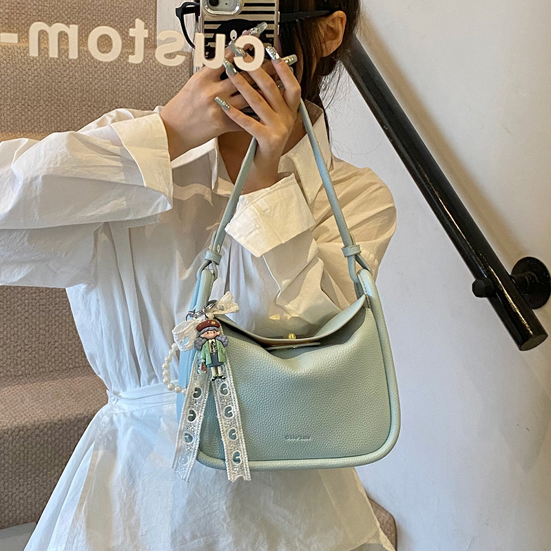 Bolso de brindis de diseño de nicho para mujer 2025 nuevo bolso de mano con patrón de lichi coreano, bolso de almohada de mensajero de un solo hombro