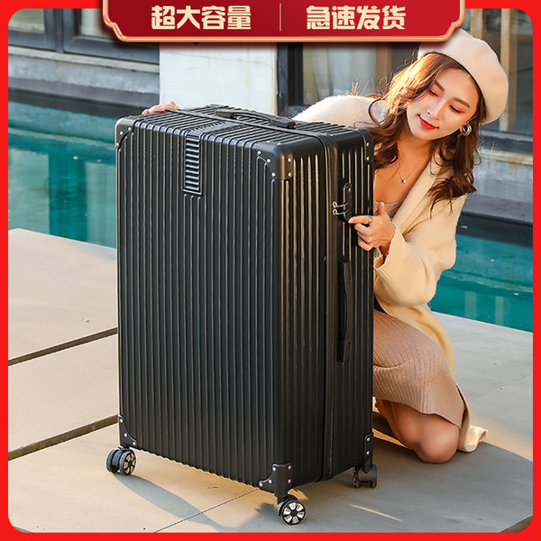 Big retro universal extra large suitcase on wheels