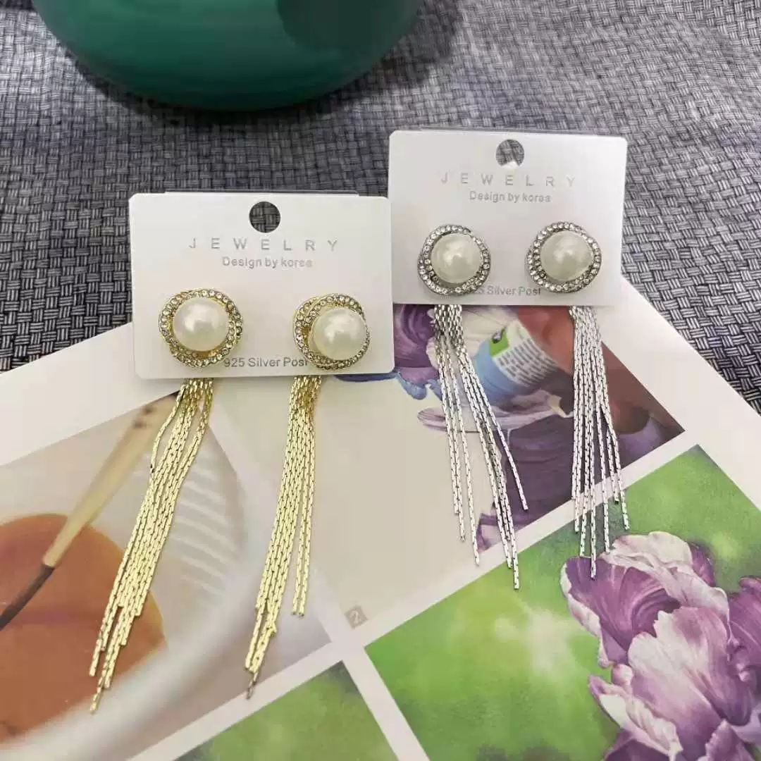 Fashionable elegant long earrings from pearl with tassels