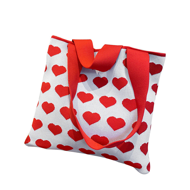 Diseño de nicho de color contrastante bolso de hombro de punto en forma de corazón bolso de mano para estudiantes simple versátil viaje bolsa de lona de gran capacidad