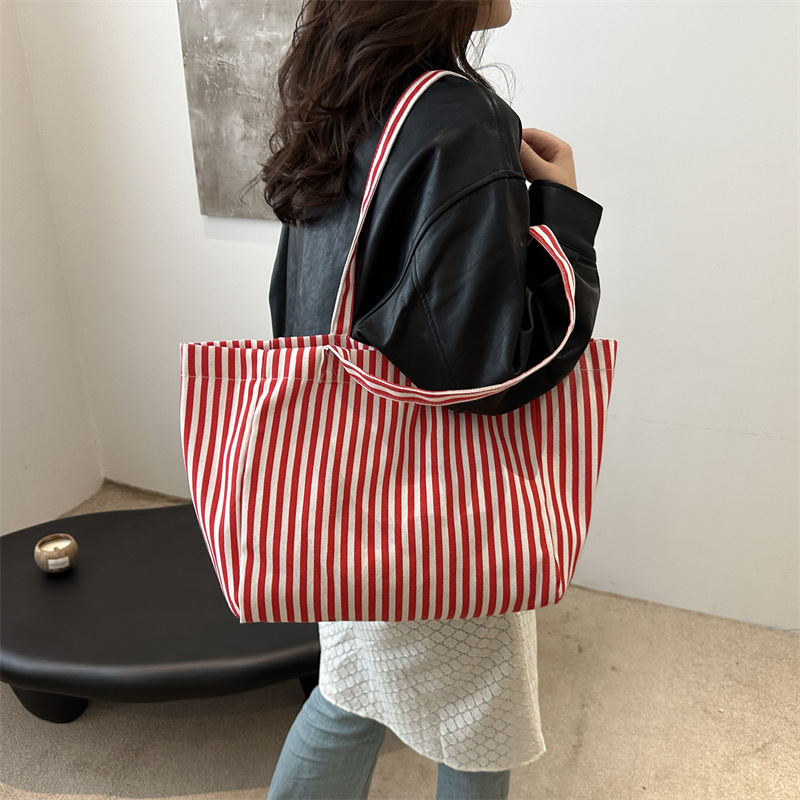 Bolsas de lona a rayas de otoño de mujeres bolsas 2024 nuevas bolsas de mano populares bolsas de hombro casuales de gran capacidad bolsas tote