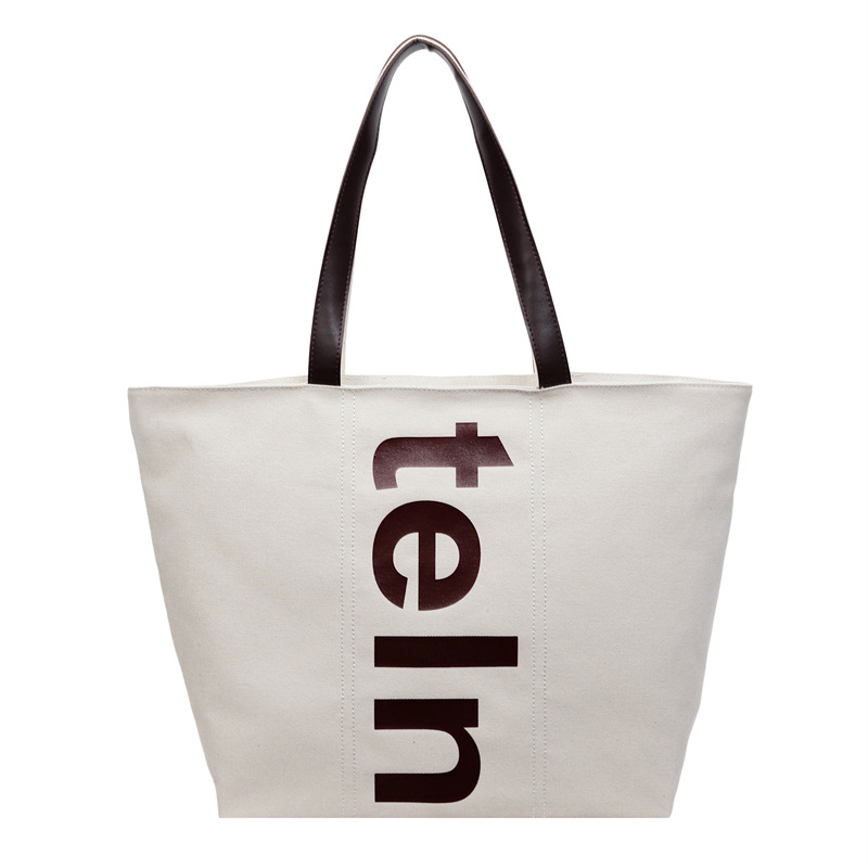 2026 nueva bolsa de hombro coreana versátil bolsa de lona casual para estudiantes universitarios de clase simple bolsa de viaje diario