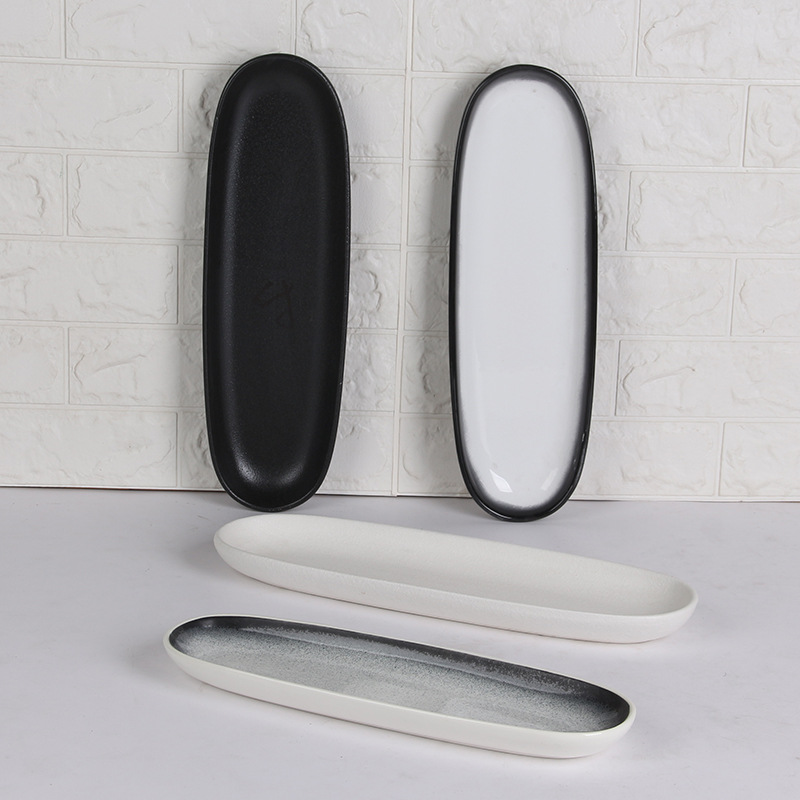 Plato de cerámica negro blanco ovalado rectangular de estilo japonés plato doméstico plato de sushi de restaurante japonés plato de ensalada plato frío