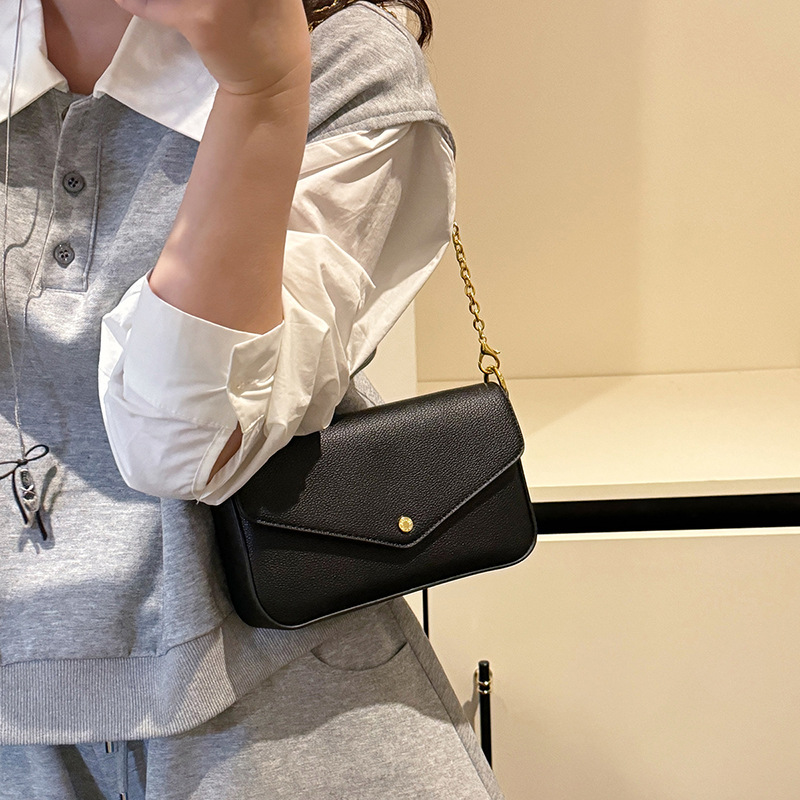 Bolso de cadena popular de este año 2025 verano nuevo bolso de hombro con patrón de lichi bolso de mensajero simple de moda mujer