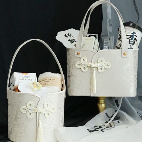 Second-hand Chinese-style satin hand-held baby basket flower qipao-style wedding favor gift for bridesmaids.