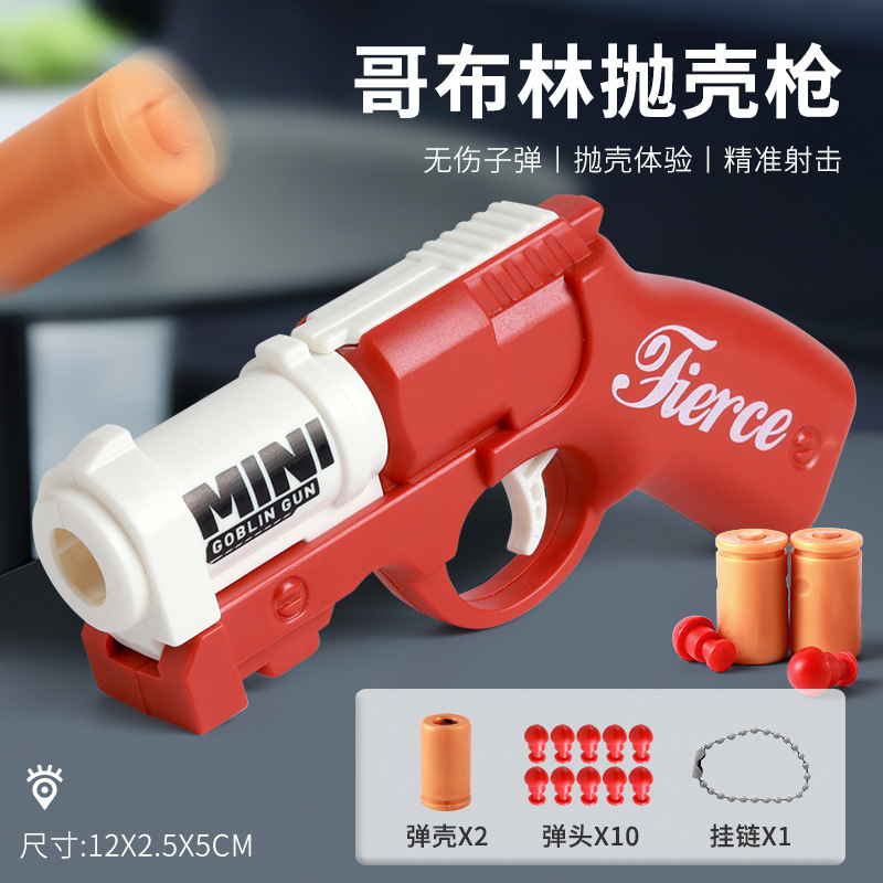 クールなストレス解消リング回転ガン、ミニバックパックチャーム、発射可能なカートリッジ、子供のおもちゃ、男の子向け、卸売