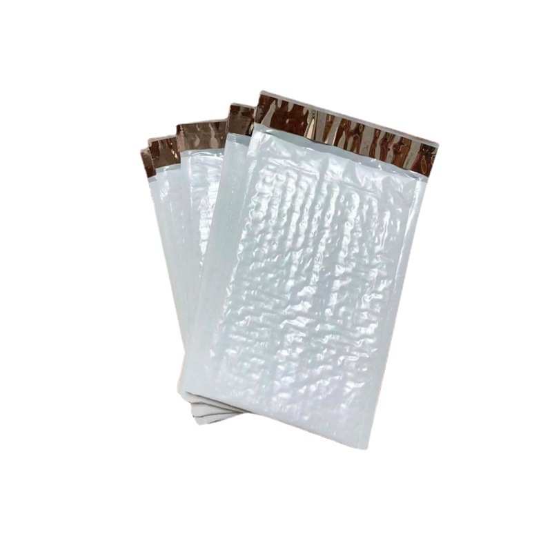 En stock bolsa de burbuja de película coextruida engrosada ropa impermeable bolsa de embalaje expreso bolsa de espuma de película de burbuja compuesta al por mayor